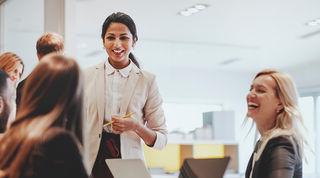 Image of two people interacting in an office environment